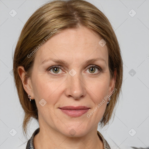 Joyful white adult female with medium  brown hair and grey eyes