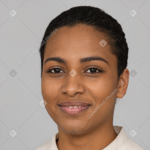 Joyful black young-adult female with short  black hair and brown eyes