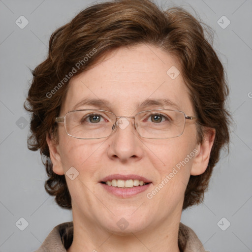 Joyful white adult female with medium  brown hair and blue eyes