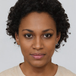 Neutral black young-adult female with short  brown hair and brown eyes