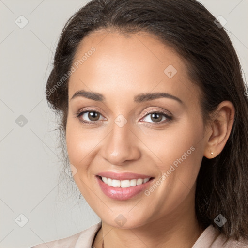 Joyful white young-adult female with long  brown hair and brown eyes