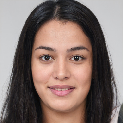 Joyful asian young-adult female with long  brown hair and brown eyes