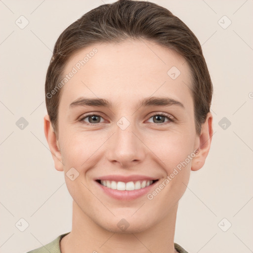 Joyful white young-adult female with short  brown hair and grey eyes