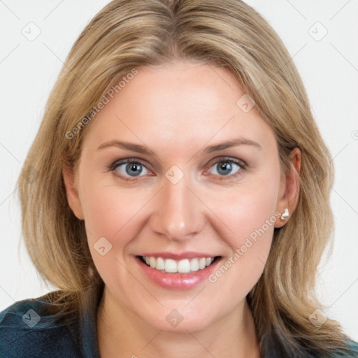 Joyful white young-adult female with long  brown hair and blue eyes