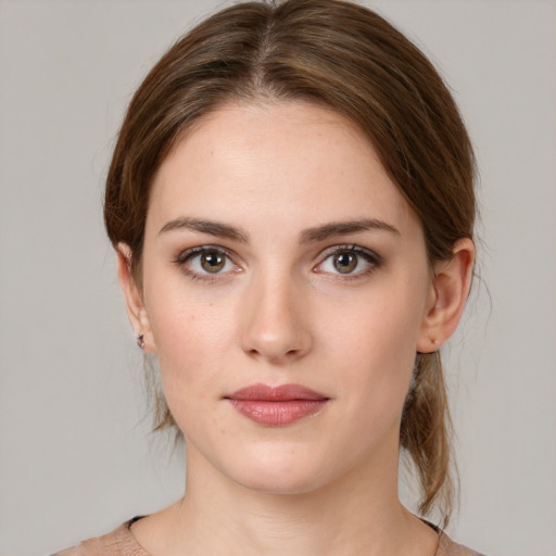 Neutral white young-adult female with medium  brown hair and brown eyes