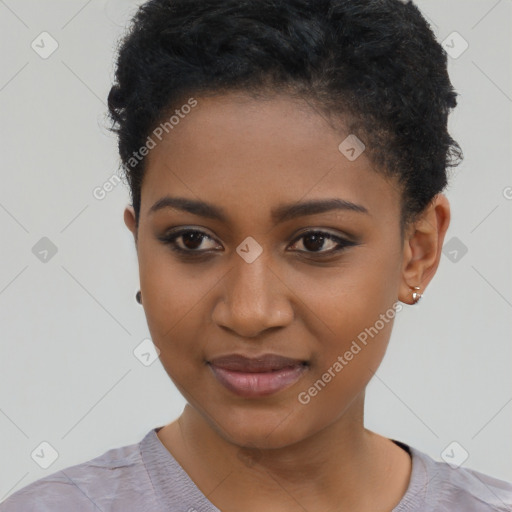 Joyful black young-adult female with short  black hair and brown eyes