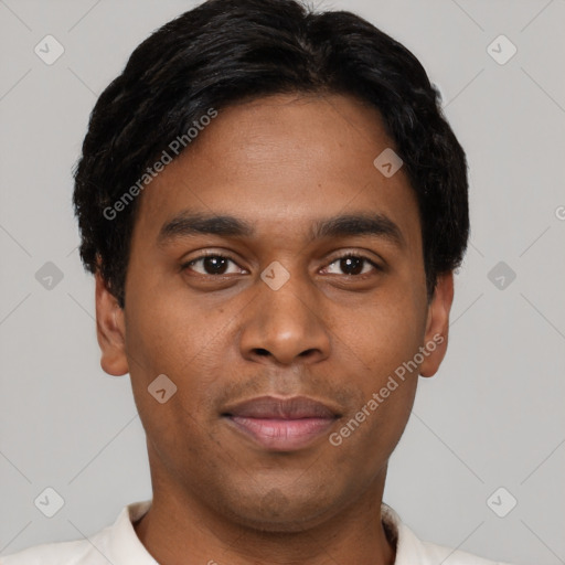 Joyful black young-adult male with short  black hair and brown eyes