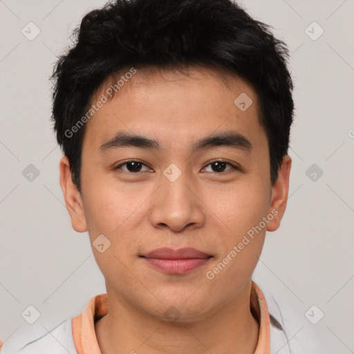 Joyful asian young-adult male with short  brown hair and brown eyes