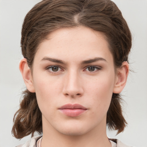 Neutral white young-adult female with medium  brown hair and grey eyes