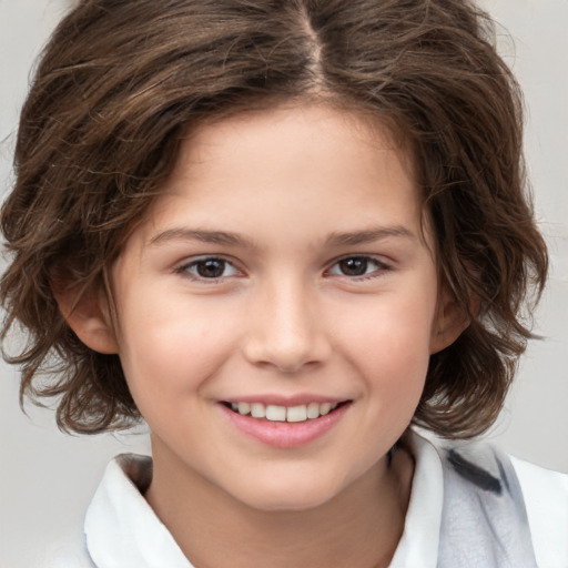 Joyful white child female with medium  brown hair and brown eyes