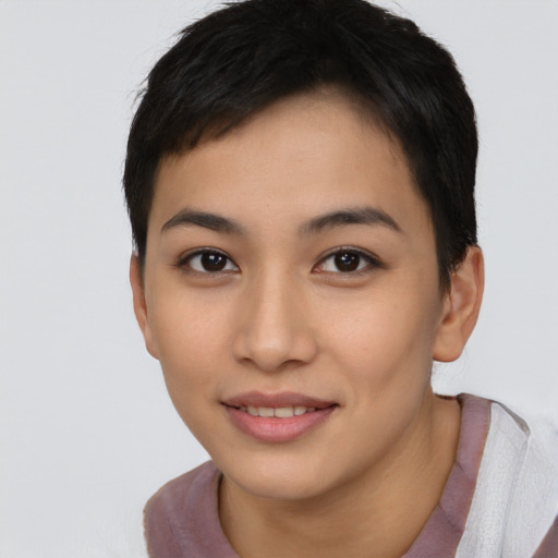 Joyful asian young-adult female with short  brown hair and brown eyes