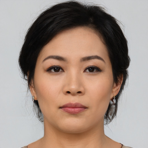 Neutral asian young-adult female with medium  brown hair and brown eyes