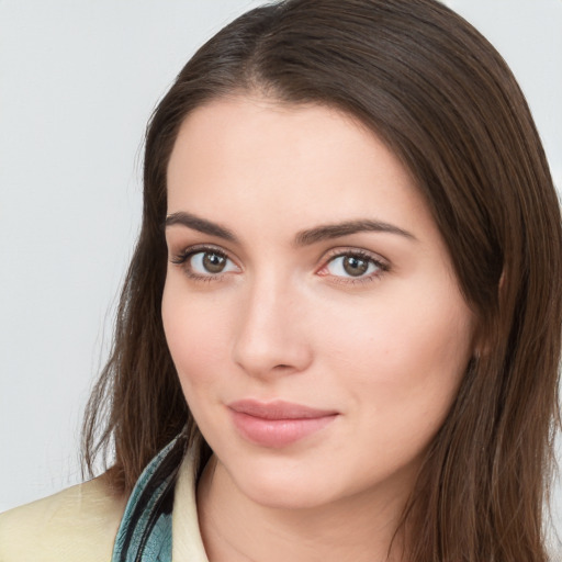 Neutral white young-adult female with long  brown hair and brown eyes