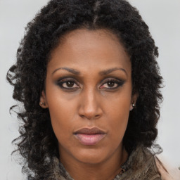 Neutral black young-adult female with long  brown hair and brown eyes