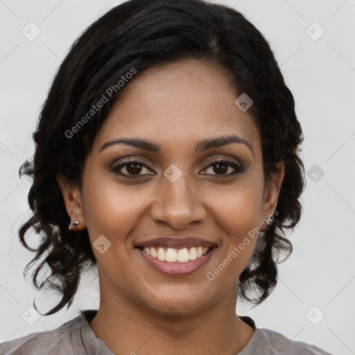 Joyful black young-adult female with medium  brown hair and brown eyes