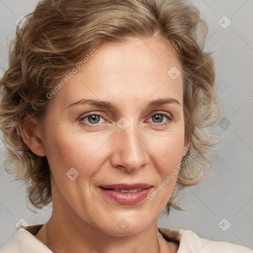 Joyful white adult female with medium  brown hair and blue eyes