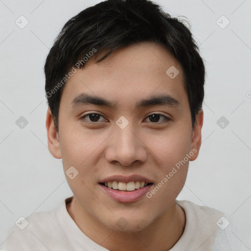 Joyful asian young-adult male with short  brown hair and brown eyes