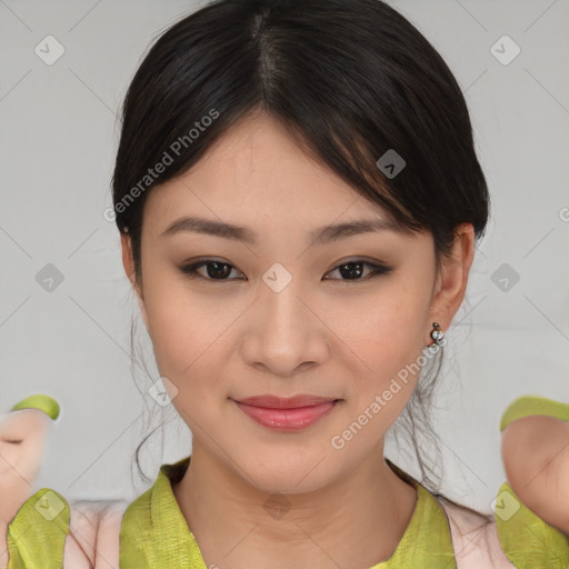 Joyful asian young-adult female with medium  brown hair and brown eyes