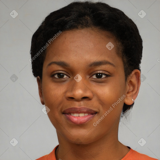 Joyful black young-adult female with short  black hair and brown eyes