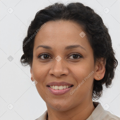 Joyful latino adult female with medium  brown hair and brown eyes