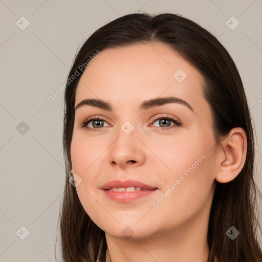 Neutral white young-adult female with long  brown hair and brown eyes