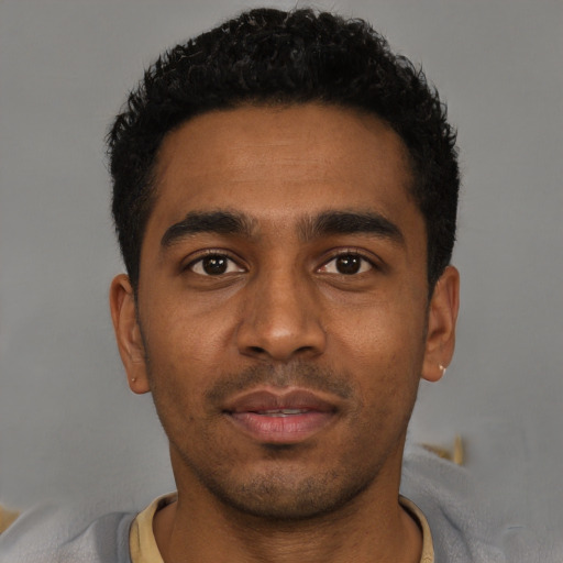 Neutral black young-adult male with short  black hair and brown eyes