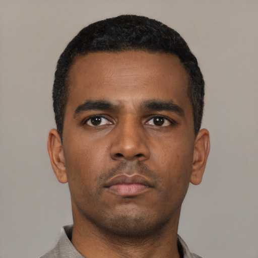 Neutral black young-adult male with short  black hair and brown eyes