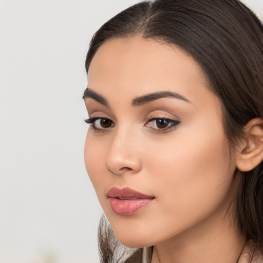 Neutral asian young-adult female with medium  brown hair and brown eyes