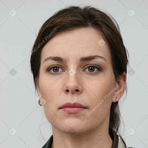 Neutral white young-adult female with medium  brown hair and grey eyes