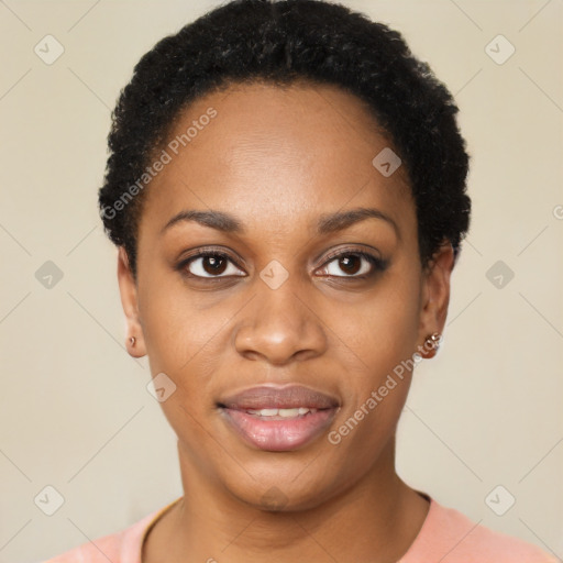 Joyful black young-adult female with short  black hair and brown eyes