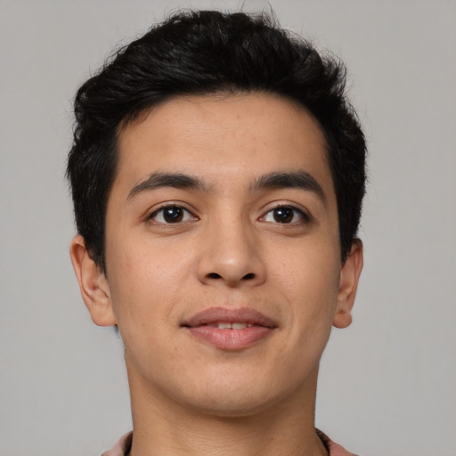 Joyful latino young-adult male with short  brown hair and brown eyes