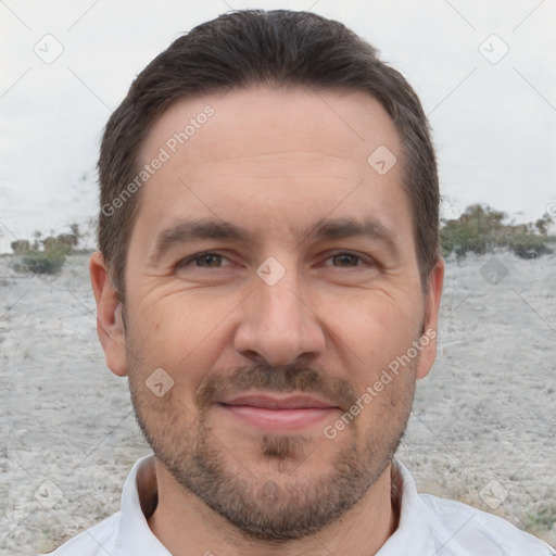 Joyful white adult male with short  brown hair and brown eyes