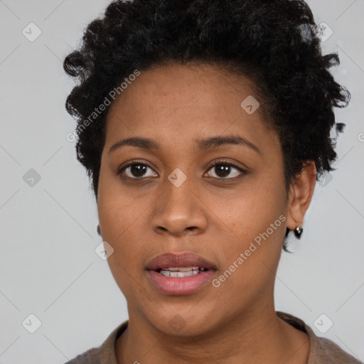 Joyful black young-adult female with short  brown hair and brown eyes