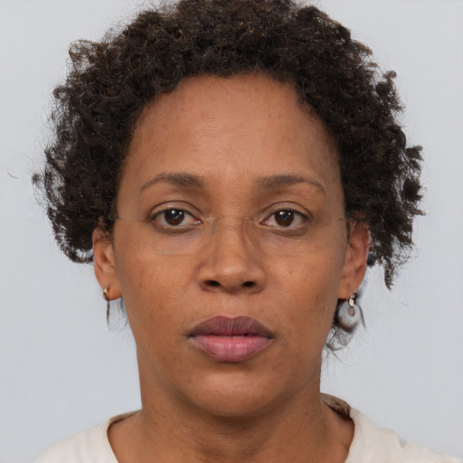 Neutral black adult female with short  brown hair and brown eyes