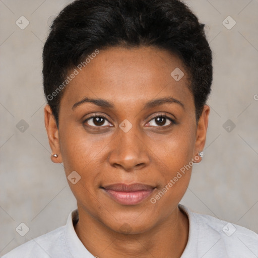 Joyful black young-adult female with short  black hair and brown eyes