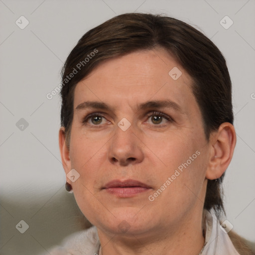 Joyful white adult female with short  brown hair and brown eyes