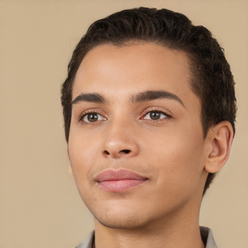 Joyful white young-adult male with short  black hair and brown eyes