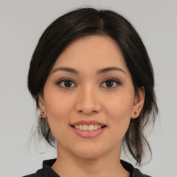 Joyful asian young-adult female with medium  brown hair and brown eyes