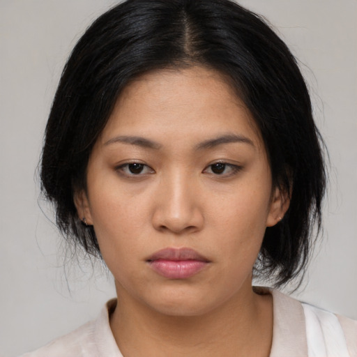 Neutral asian young-adult female with medium  black hair and brown eyes