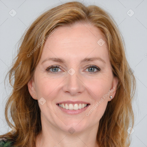 Joyful white young-adult female with medium  brown hair and blue eyes