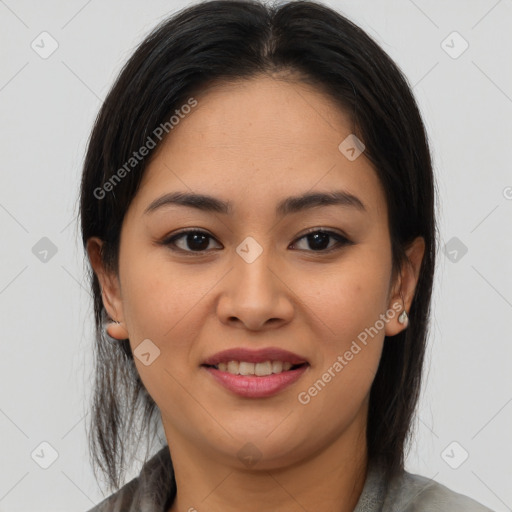 Joyful latino young-adult female with medium  brown hair and brown eyes