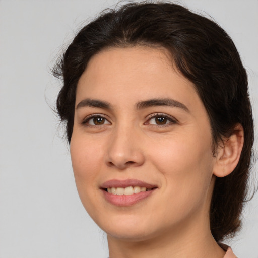 Joyful white young-adult female with medium  brown hair and brown eyes