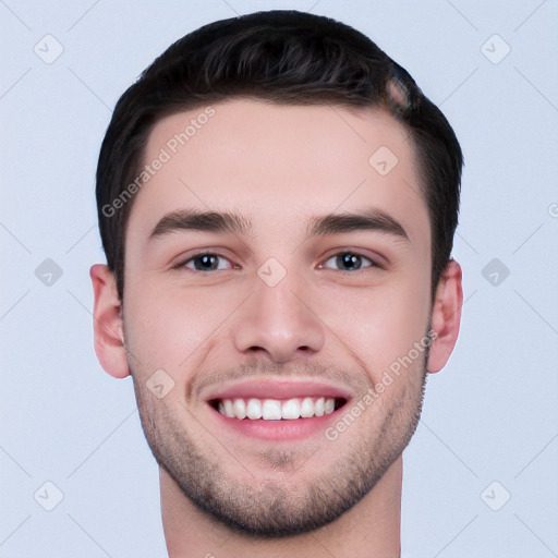 Joyful white young-adult male with short  black hair and brown eyes