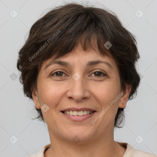 Joyful white adult female with medium  brown hair and brown eyes