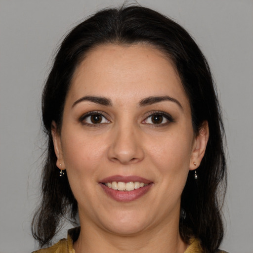 Joyful white young-adult female with medium  brown hair and brown eyes