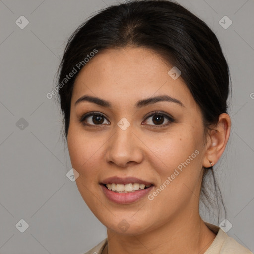 Joyful latino young-adult female with medium  brown hair and brown eyes