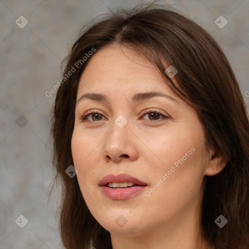 Joyful white adult female with medium  brown hair and brown eyes