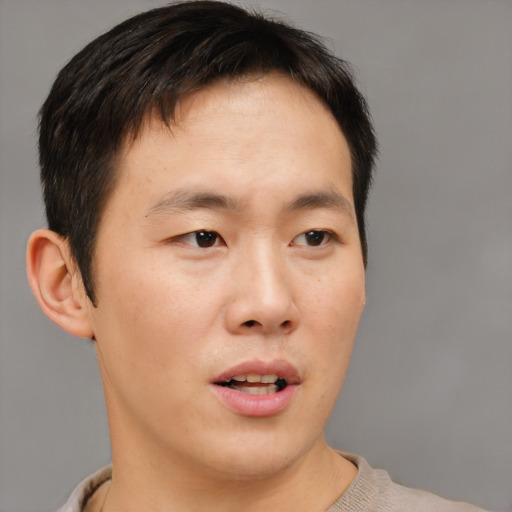 Neutral asian young-adult male with short  brown hair and brown eyes
