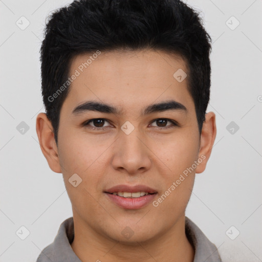 Joyful asian young-adult male with short  brown hair and brown eyes