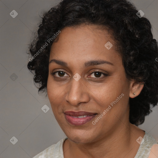 Joyful black adult female with short  brown hair and brown eyes